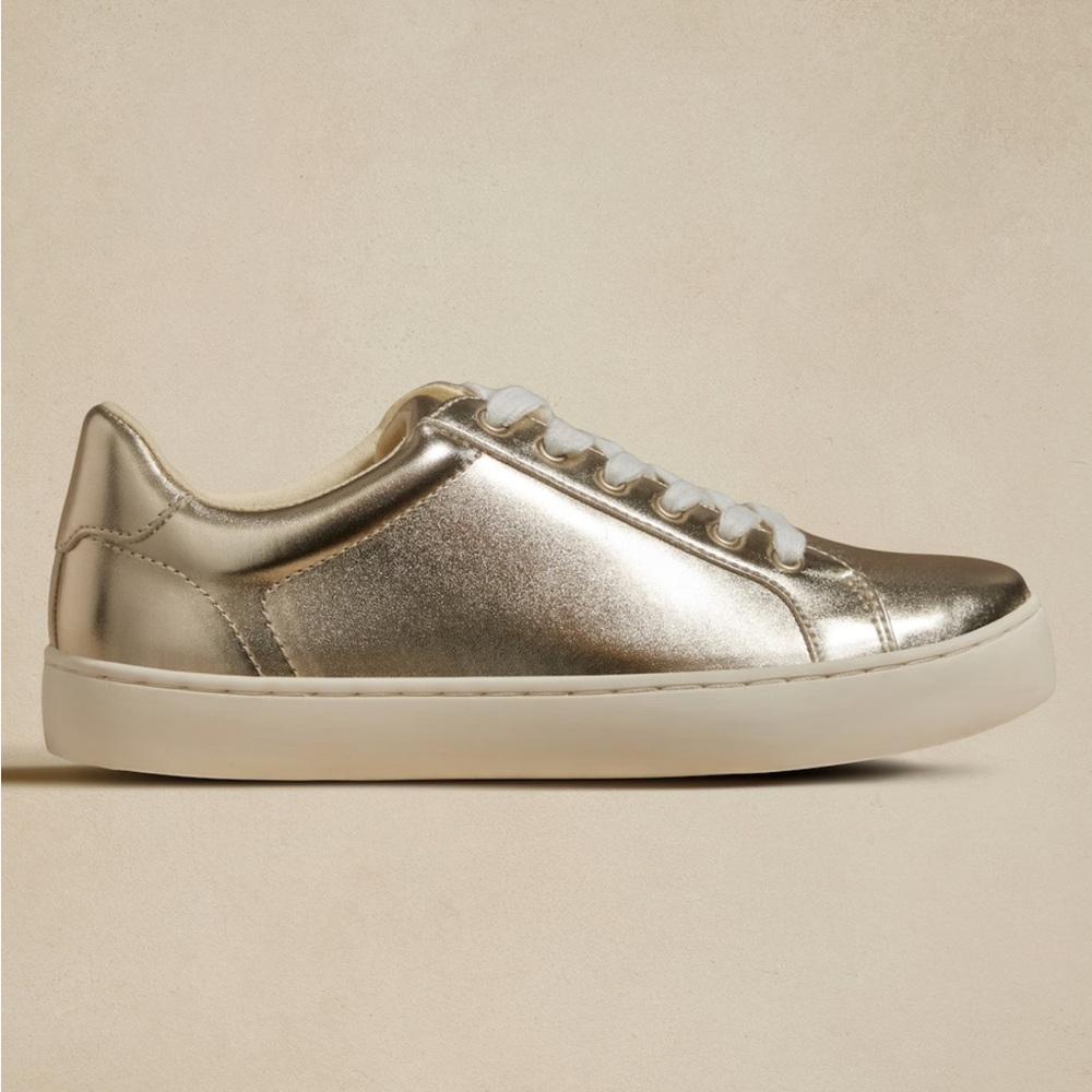 Gold Metallic Sneaker with flat White Laces. NWT Size 6